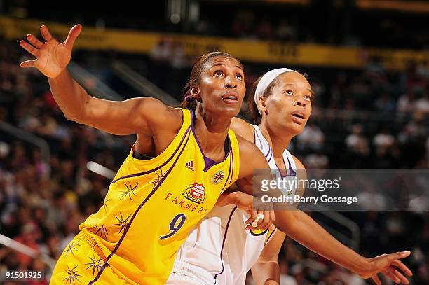 Lisa Leslie of the Los Angeles Sparks boxes out Tangela Smith of the Phoenix Mercury in Game Two of the Western Conference Finals during the 2009...