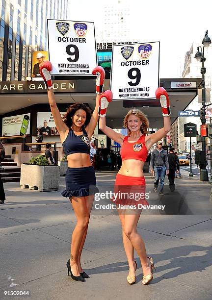 Models Tarale Wulff and Annmarie Nitti promote "Battle of the Badges" boxing tournament between NYPD and NYFD at Madison Square Garden on October 6,...