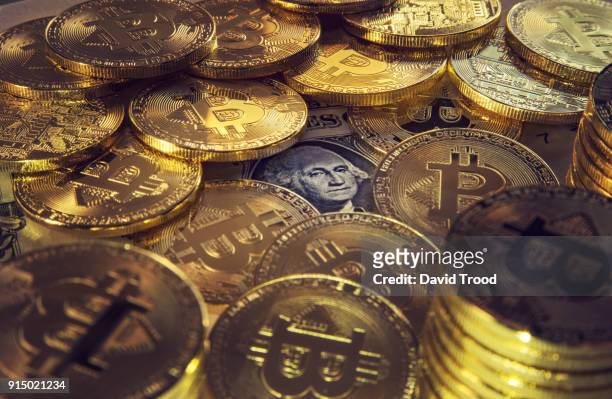 physical version of bitcoin coin aka virtual money. - david trood stockfoto's en -beelden
