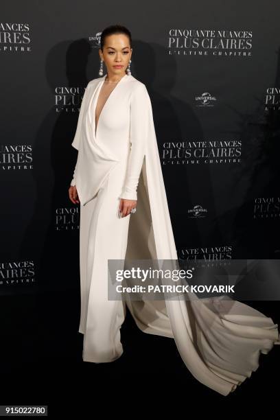 Rita Ora poses as she arrives to attend 'Fifty Shades Freed - 50 Nuances Plus Claires' Premiere at Salle Pleyel in Paris on February 6, 2018. / AFP...