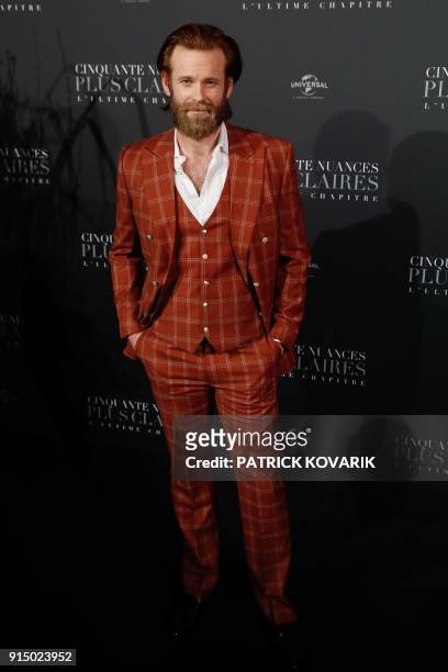 Actor Eric Johnson poses as he arrives to attend 'Fifty Shades Freed - 50 Nuances Plus Claires' Premiere at Salle Pleyel in Paris on February 6,...