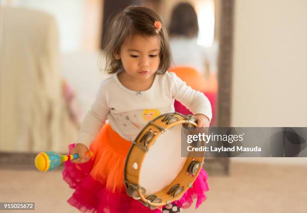 tambourine toddler - maracas fotografías e imágenes de stock