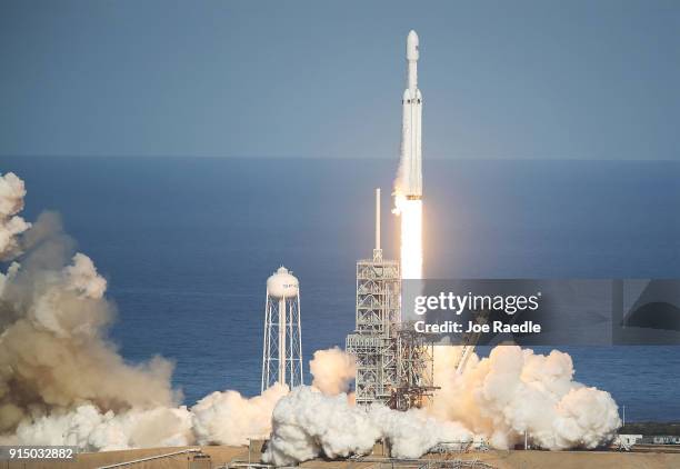 The SpaceX Falcon Heavy rocket lifts off from launch pad 39A at Kennedy Space Center on February 6, 2018 in Cape Canaveral, Florida. The rocket is...