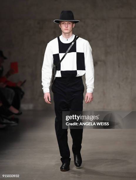 Model walks the runway at the Carlos Campos fashion show during New York Fashion Week Mens' at Skylight Modern on February 6, 2018 in New York City....