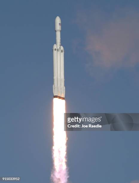 The SpaceX Falcon Heavy rocket lifts off from launch pad 39A at Kennedy Space Center on February 6, 2018 in Cape Canaveral, Florida. The rocket is...