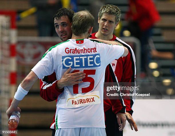 Gerrie Eijlers and Yves Grafenhorst of Magdeburg celebrate the 29-21 victory after the Toyota Handball Bundesliga match between HSG Duesseldorf and...