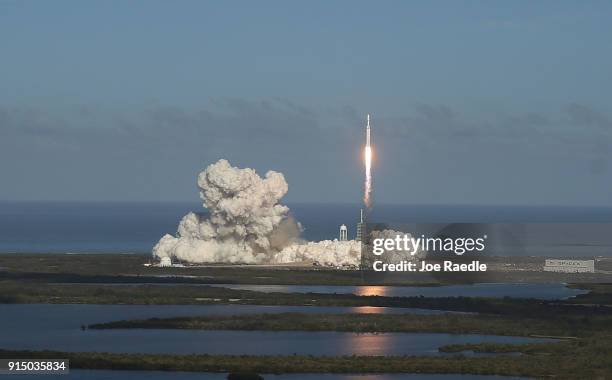 The SpaceX Falcon Heavy rocket lifts off from launch pad 39A at Kennedy Space Center on February 6, 2018 in Cape Canaveral, Florida. The rocket is...