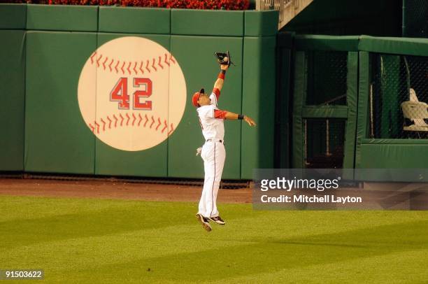 Mike Morse of the Washington Nationals catches a fly bal during a baseball game against the Washington Nationals on September 29, 2009 at Nationals...
