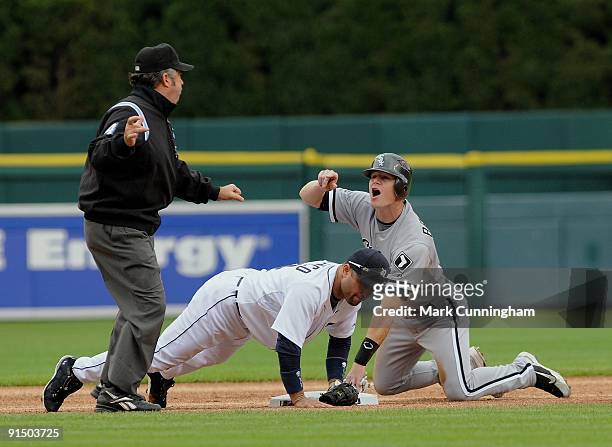 Gordon Beckham of the Chicago White Sox looks up in disbelief as Major League umpire Tim Tschida calls him out at second base after being tagged by...