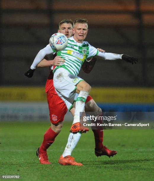 Yeovil Town's Sam Surridge under pressure from Fleetwood Town's Ashley Eastham during the Checkatrade Trophy Quarter-Final match between Yeovil Town...