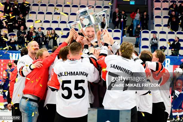 Jyvaskyla's players celebrate after winning the Champions Hockey League final match between Vaxjo Lakers and JYP Jyvaskyla at the Vida Arena in...