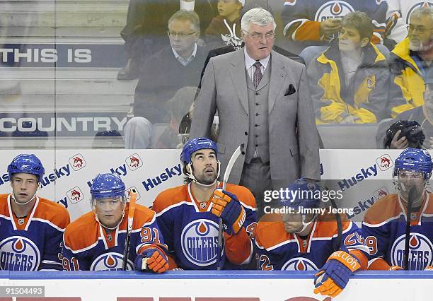 Head coach Pat Quinn and his Edmonton Oilers sit on the bench in a game between the Calgary Flames and the Edmonton Oilers in an NHL game on October...