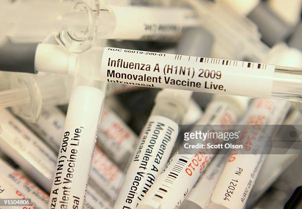 Doses of H1N1 influenza vaccine sit in a basket at Rush University Medical Center October 6, 2009 in Chicago, Illinois. Rush is one of many hospitals...