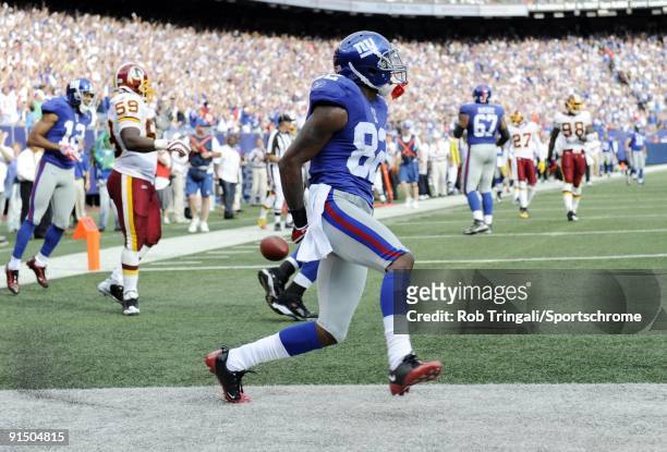 Mario Manningham of the New York Giants scores a touchdown against the Washington Redskins during their game on September 13, 2009 at Giants Stadium...