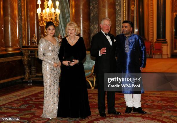 Prince Charles, Prince of Wales poses with singer Kanika Kapooi , Camilla Duchess of Cornwall and Naughty Boy at a reception and dinner for the...