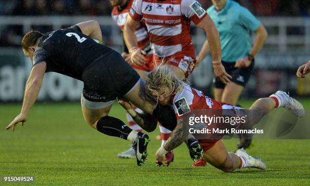 Richard Hibbard of Gloucester Rugby tackles Kyle Cooper of Newcastle Falcons during the Anglo-Welsh Cup match between Newcastle Falcons and...