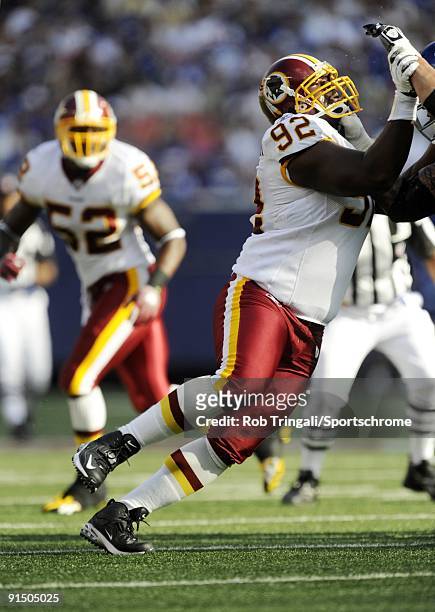 Albert Haynesworth of the Washington Redskins defends against the New York Giants during their game on September 13, 2009 at Giants Stadium in East...