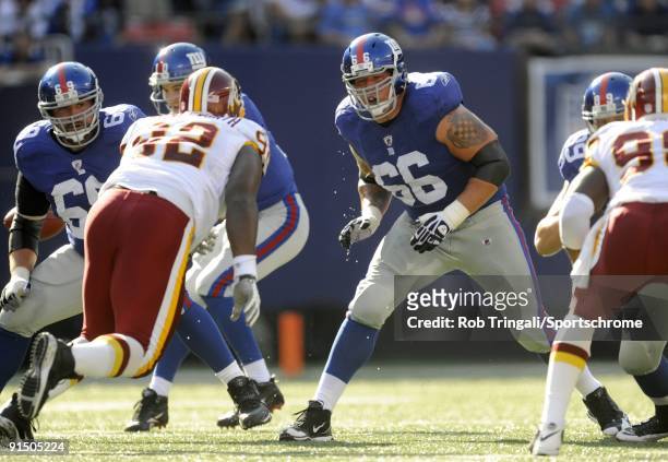 David Diehl of the New York Giants blocks against the Washington Redskins during their game on September 13, 2009 at Giants Stadium in East...