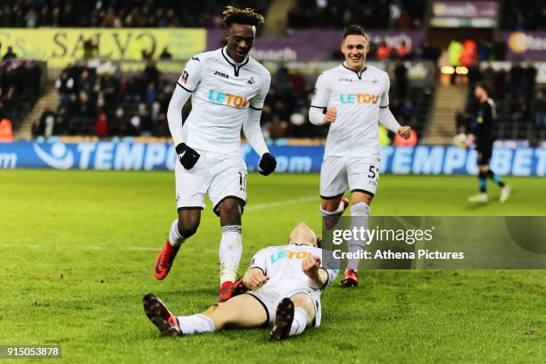 Daniel James of Swansea celebrates his goal with team mates Tammy Abraham and Connor Roberts during The Emirates FA Cup match between Swansea City...