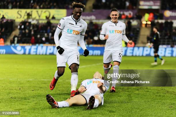 Daniel James of Swansea celebrates his goal with team mates Tammy Abraham and Connor Roberts during The Emirates FA Cup match between Swansea City...