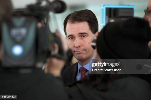 Wisconsin Governor Scott Walker speaks to the press at an event held to announce Foxconn's plan to purchase an office building from Northwestern...