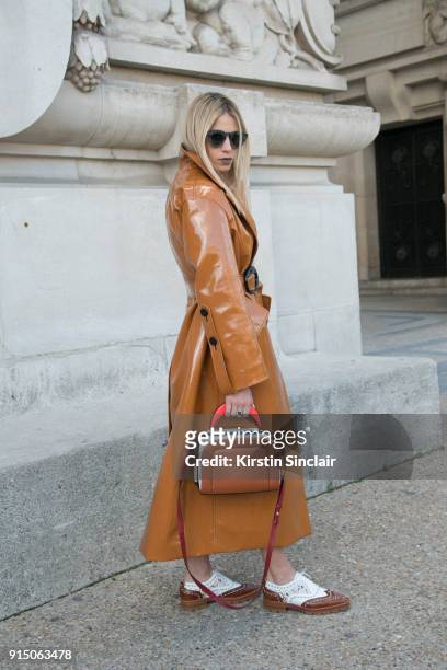 Creative Director and Founder of Beyond The Mag Sophia Macks wears an Ellery coat, Marni bag, Louis Vuitton shoes and Dita sunglasses day 5 of Paris...