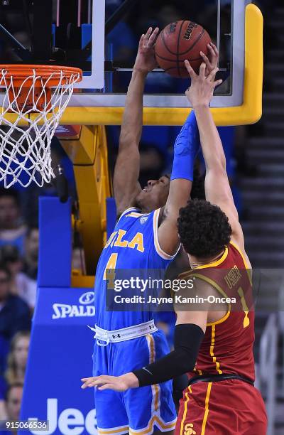 Jordan Usher of the USC Trojans blocks a shot by Jaylen Hands of the UCLA Bruins at Pauley Pavilion on February 3, 2018 in Los Angeles, California.