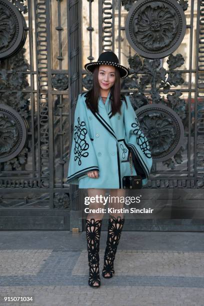 Fashion buyer Nicole Hoi wears an Elie Saab jacket, Giuseppe Zanotti boots and Chanel bag day 5 of Paris Womens Fashion Week Spring/Summer 2018, on...