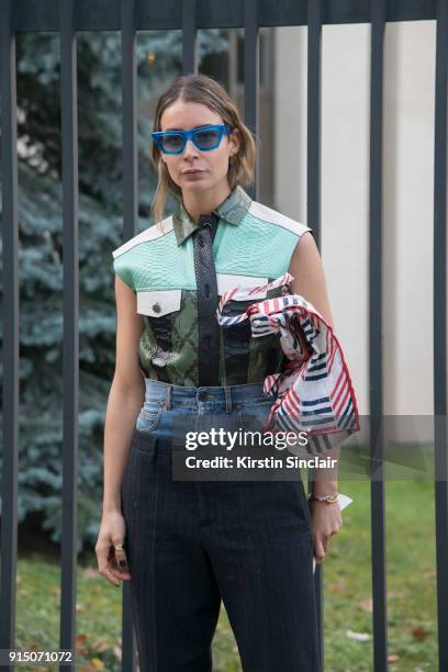 Editor in chief at MINT Magazine Irina Lakicevic wears a Proenza Schouler vest, Maison Martin Margiela trousers and Celine sunglasses day 5 of Paris...