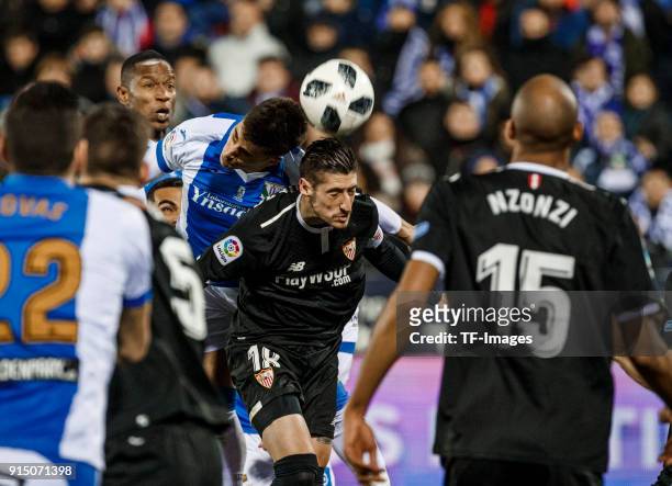 Player of Leganes and Sergio Escudero of Sevilla battle for the ball during the Copa del Rey semi-final first leg match between CD Leganes and...