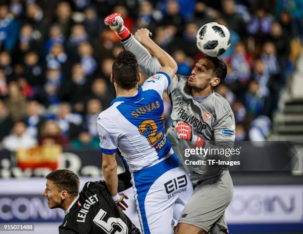 Siovas of Leganes scores the team`s first goal and Sergio Rico of Sevilla in action during the Copa del Rey semi-final first leg match between CD...