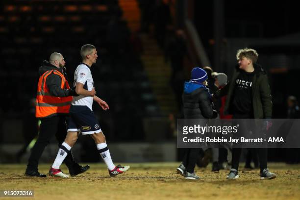Steve Morison of Millwall is escorted off the pitch by a steward at full time during The Emirates FA Cup Fourth Round Replay at Spotland Stadium on...