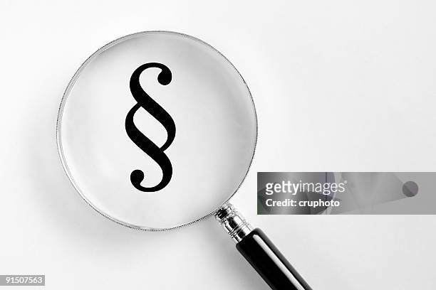paragraph symbol in the microscope - copyright stock pictures, royalty-free photos & images