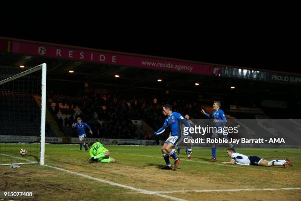 Ian Henderson of Rochdale scores a goal to make it 1-0 during The Emirates FA Cup Fourth Round Replay at Spotland Stadium on February 6, 2018 in...