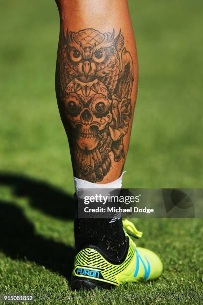 Nathan Jones of the Demons shows off a leg tattoo during a Melbourne Demons AFL training session at Gosch's Paddock on February 7, 2018 in Melbourne,...