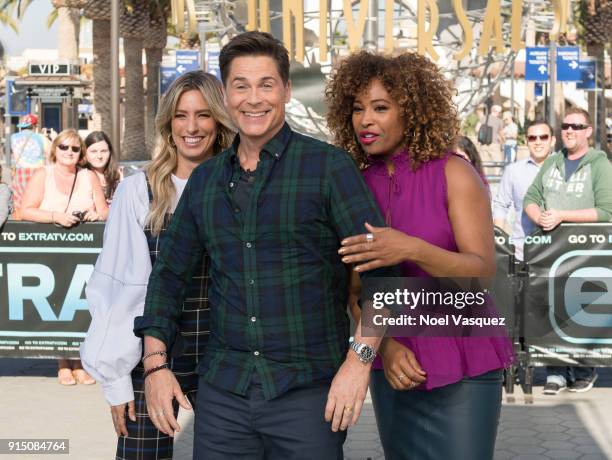 Renee Bargh, Rob Lowe and Tanika Ray visit "Extra" at Universal Studios Hollywood on February 6, 2018 in Universal City, California.