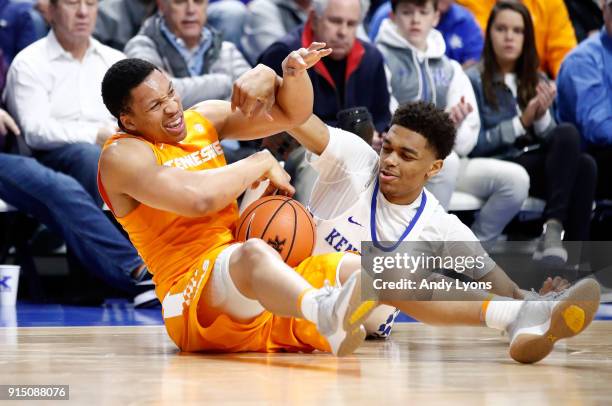 Grant Williams of the Tennessee Volunteers and PJ Washington of the Kentucky Wildcats battle for a loose ball during the game at Rupp Arena on...