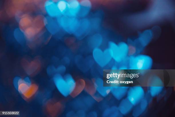 blue abstract background with heat bokeh - heart abstract stock-fotos und bilder