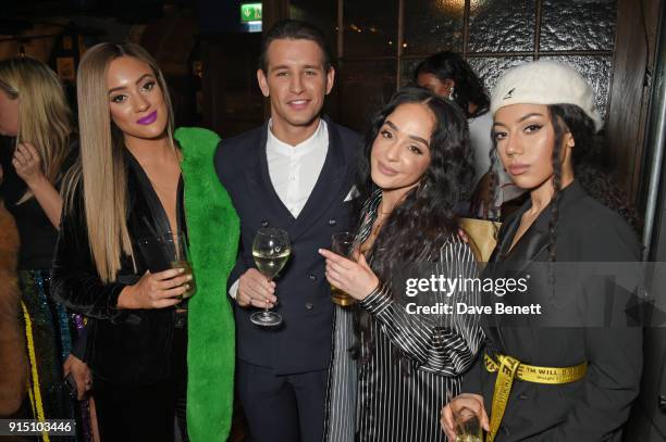 Ollie Locke poses with Annie Ashcroft, Chanal Benjilali and Nadine Samuels of M.O at the InStyle EE Rising Star Party at Granary Square on February...