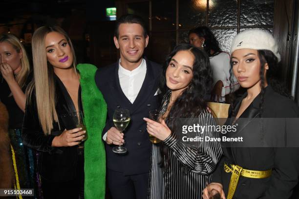 Ollie Locke poses with Annie Ashcroft, Chanal Benjilali and Nadine Samuels of M.O at the InStyle EE Rising Star Party at Granary Square on February...