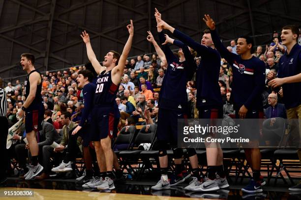 Matt MacDonald of the Pennsylvania Quakers reacts with his team on the bench to a three point basket against the Princeton Tigers during the second...