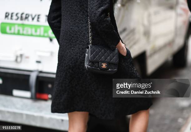Guest is seen with a Chanel purse outside the Carlos Campos show during New York Fashion Week: Men's A/W 2018 on February 6, 2018 in New York City.