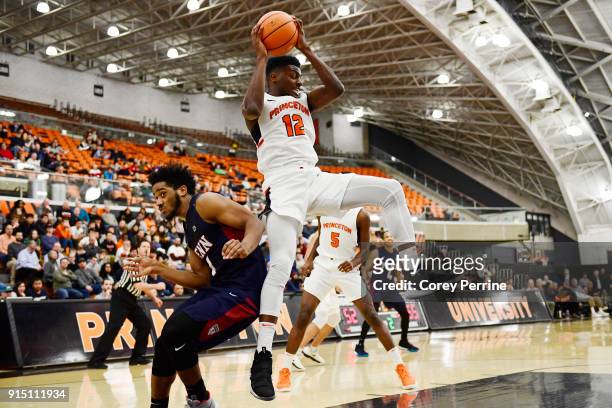 Myles Stephens of the Princeton Tigers rebounds against Antonio Woods of the Pennsylvania Quakers during the second half at L. Stockwell Jadwin...