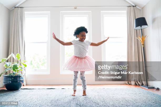 girl performing ballet dance at home - saia de bailarina imagens e fotografias de stock