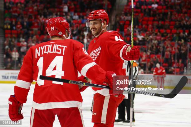 Martin Frk of the Detroit Red Wings celebrates a second period goal with Gustav Nyquist while playing the Boston Bruins at Little Caesars Arena on...