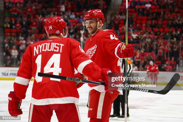 Martin Frk of the Detroit Red Wings celebrates a second period goal with Gustav Nyquist while playing the Boston Bruins at Little Caesars Arena on...
