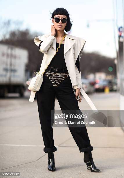 Michelle Song is seen wearing a Drome jacket, Y/Project pants, Saint Laurent shoes and Pinko sunglasses outside the Death to Tennis show during New...