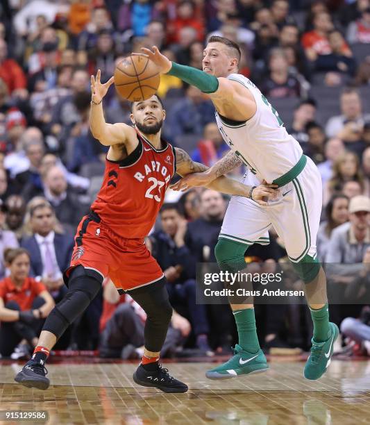 Daniel Theis of the Boston Celtics battles against Fred Vanvleet of the Toronto Raptors in an NBA game at the Air Canada Centre on February 6, 2018...