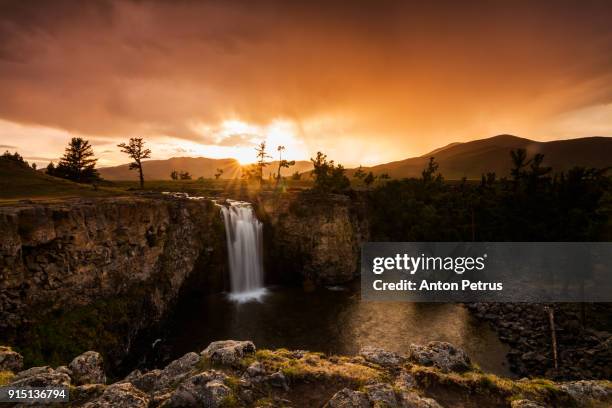 orkhon waterfall at sunset in mongolia - orkhon river stock pictures, royalty-free photos & images