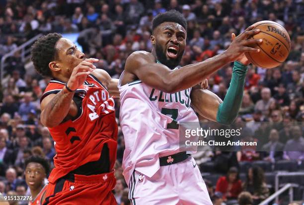 Jaylen Brown of the Boston Celtics battles against DeMar DeRozan of the Toronto Raptors in an NBA game at the Air Canada Centre on February 6, 2018...